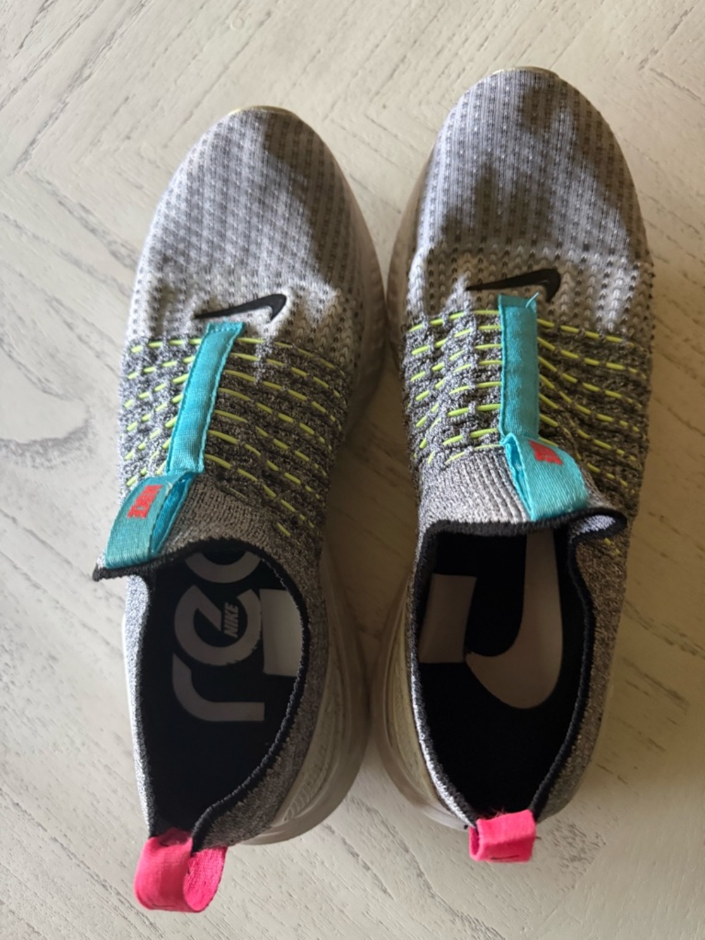 Nike Men’s Grey Flyknit Slip-On Sneakers with Teal and Pink Accents